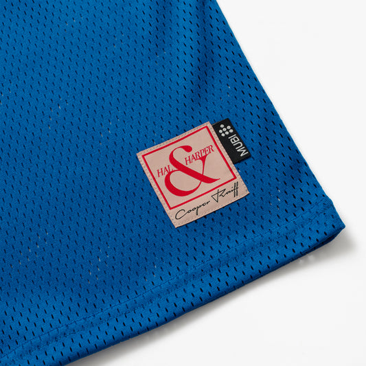 Blue mesh basketball jersey with a label featuring HAL & HARPER and MUBI label on a white background